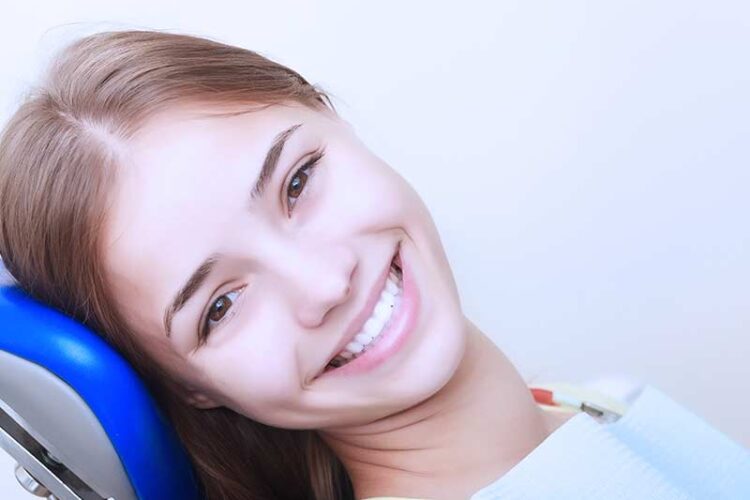 patient smiling relaxed at dentist