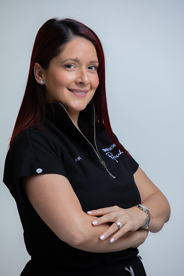 Aylen, Office Manager at Deluxe Dental in Miami, smiling for her professional bio photo.