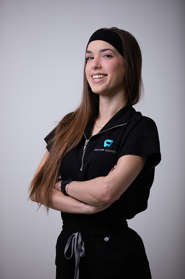Heidi, Dental Assistant at Deluxe Dental in Miami, smiling for her professional bio photo.